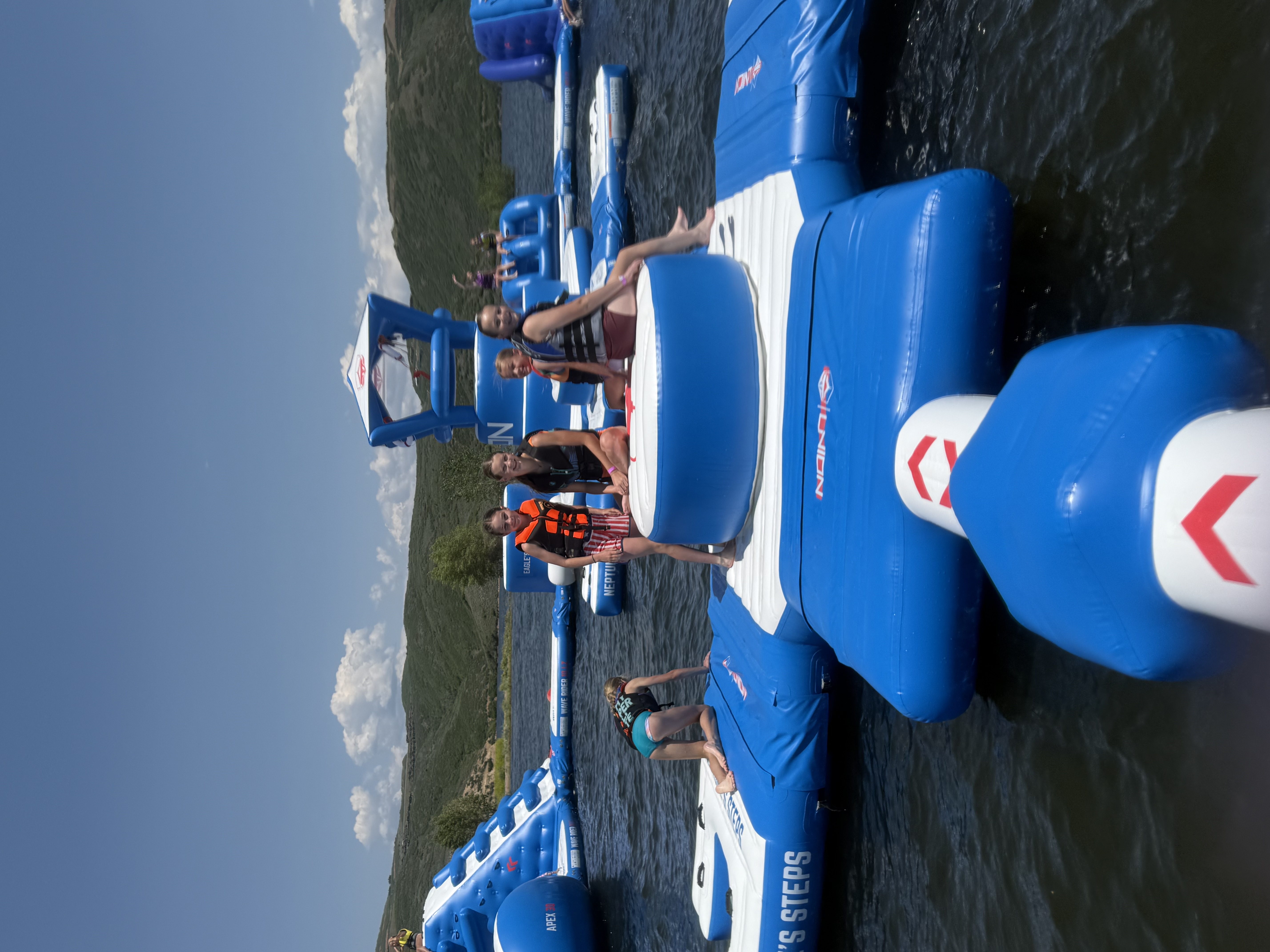 Guests playing on the Jordanelle Aqua Park floating water playground